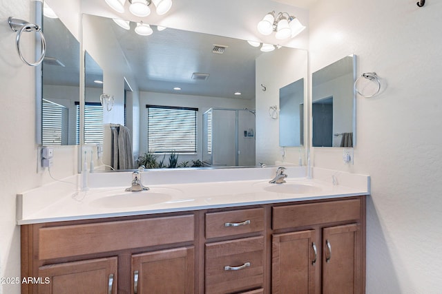 full bathroom featuring a shower stall and double vanity