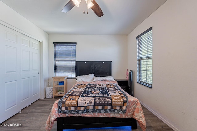 bedroom with wood finished floors, ceiling fan, and baseboards