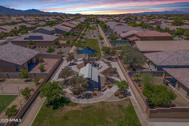 aerial view at dusk of a residential view and a mountain view
