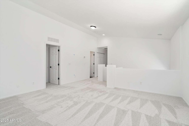 23772 W Grove St, Buckeye, AZ 85326 - carpeted spare room with lofted ceiling and baseboards
