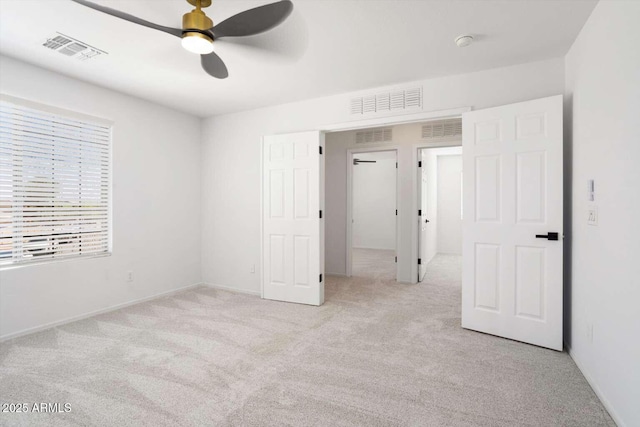23772 W Grove St, Buckeye, AZ 85326 - unfurnished bedroom featuring light colored carpet, a ceiling fan, and baseboards