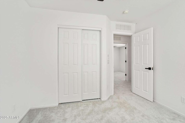 23772 W Grove St, Buckeye, AZ 85326 - unfurnished bedroom featuring light carpet, baseboards, and a closet