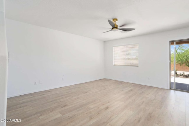 23772 W Grove St, Buckeye, AZ 85326 - unfurnished room with a ceiling fan, light wood-type flooring, and baseboards