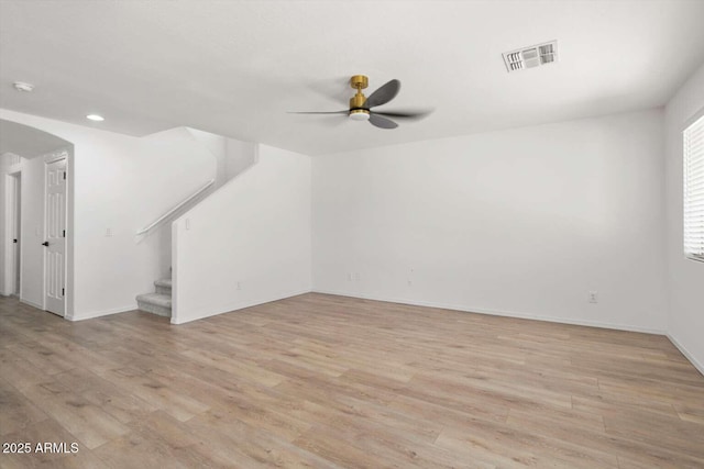 23772 W Grove St, Buckeye, AZ 85326 - unfurnished living room with a ceiling fan, light wood-type flooring, stairs, baseboards, and recessed lighting