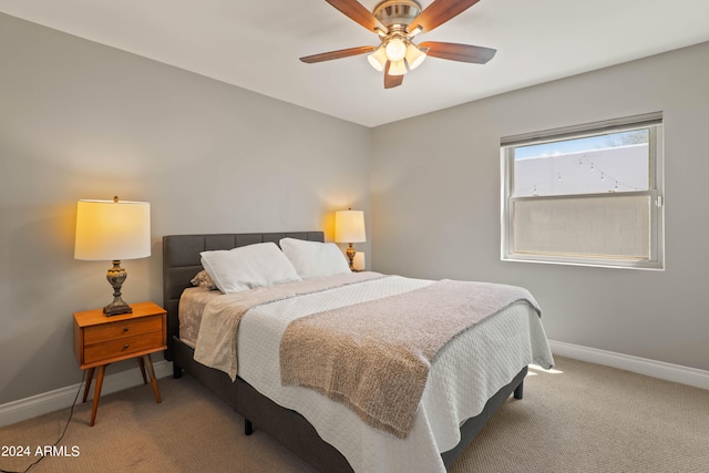 carpeted bedroom featuring ceiling fan