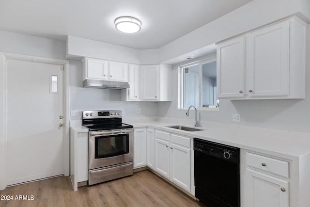 kitchen featuring black dishwasher, sink, white cabinets, light hardwood / wood-style flooring, and stainless steel electric stove