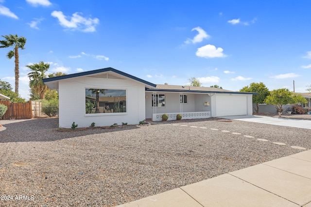 view of front of house featuring a garage and a porch