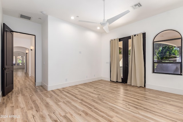 spare room with light hardwood / wood-style floors and ceiling fan