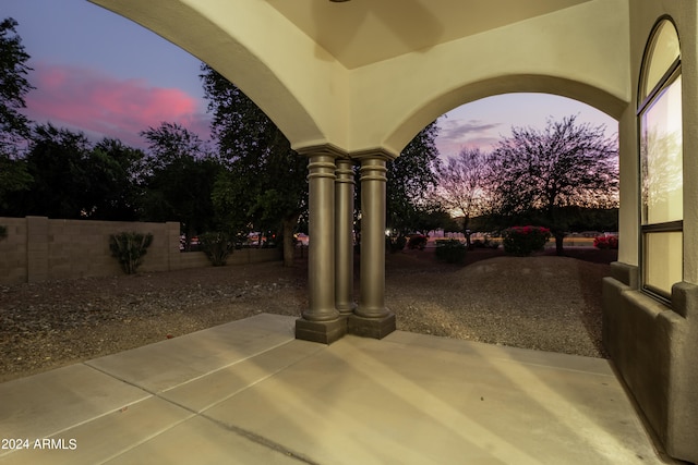 view of patio terrace at dusk