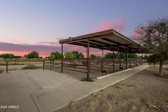 view of horse barn featuring a rural view