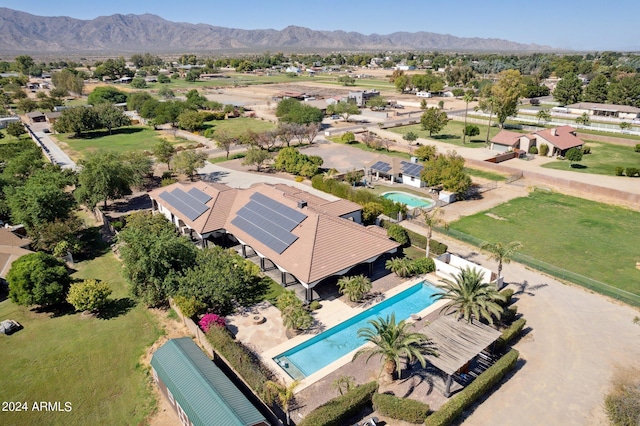 birds eye view of property with a mountain view