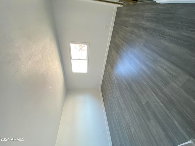 empty room with dark hardwood / wood-style flooring