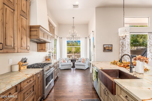 kitchen with pendant lighting, stainless steel stove, custom range hood, an inviting chandelier, and dark hardwood / wood-style flooring