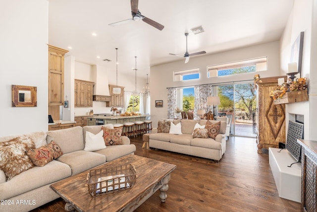 living room with ceiling fan and dark hardwood / wood-style floors