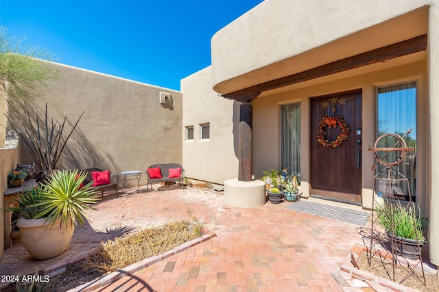 entrance to property with a patio area