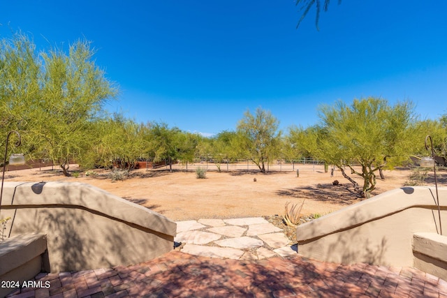 view of yard with a patio and a rural view