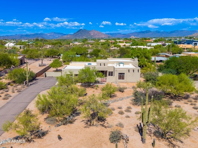 birds eye view of property featuring a mountain view