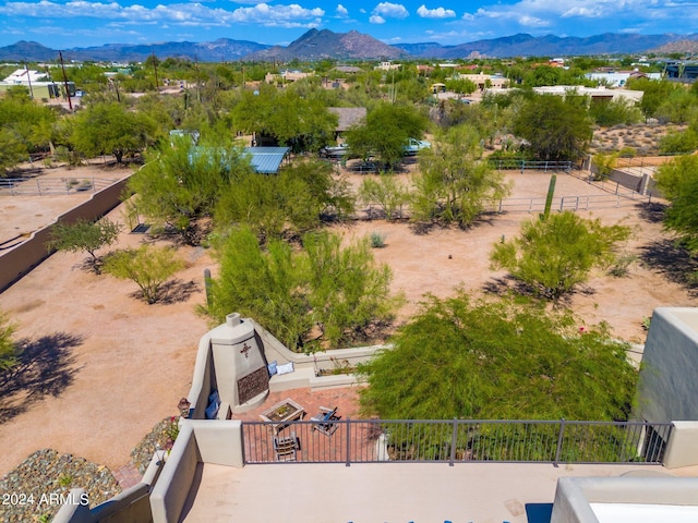 birds eye view of property with a mountain view