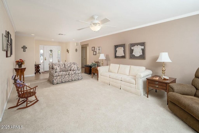 living room with a ceiling fan, carpet, visible vents, and crown molding