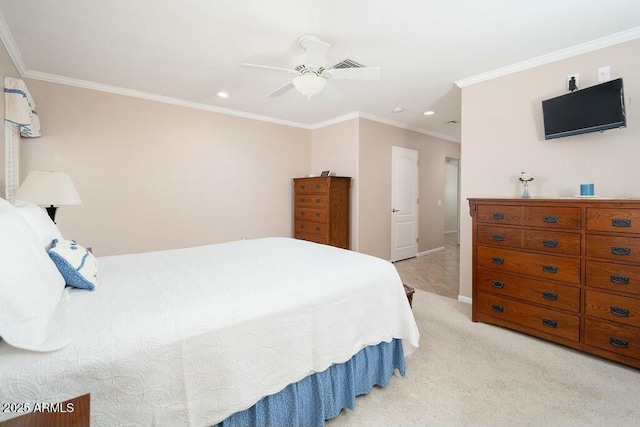 bedroom featuring light colored carpet, visible vents, baseboards, a ceiling fan, and crown molding