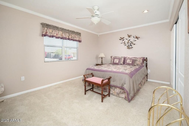 carpeted bedroom with ornamental molding, a closet, a ceiling fan, and baseboards