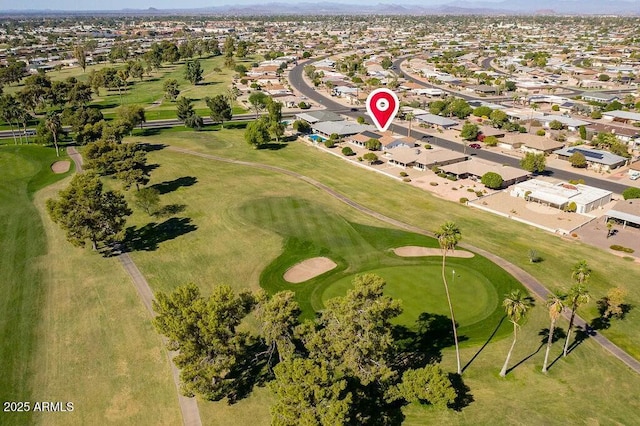 drone / aerial view featuring a residential view and golf course view