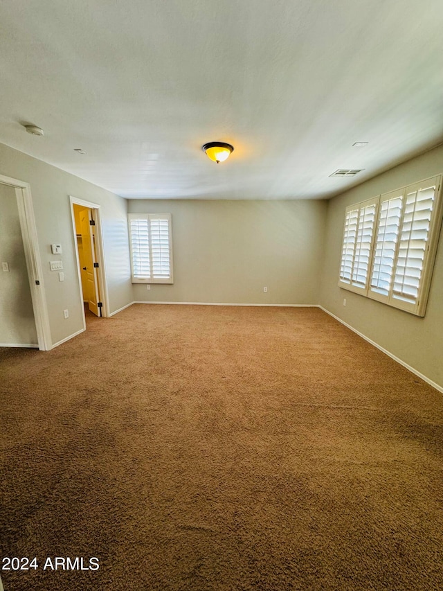 empty room featuring carpet flooring