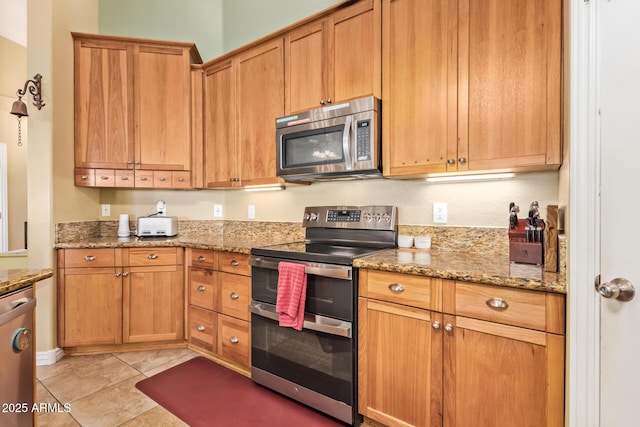 36641 N Railway St, San Tan Valley, AZ 85140 - kitchen with appliances with stainless steel finishes, light tile patterned floors, and light stone counters