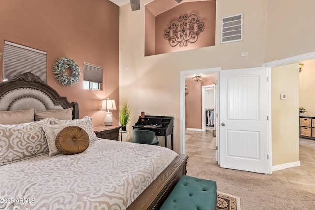 36641 N Railway St, San Tan Valley, AZ 85140 - bedroom featuring baseboards, light colored carpet, a towering ceiling, and visible vents