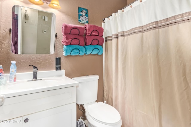 36641 N Railway St, San Tan Valley, AZ 85140 - full bath featuring toilet, vanity, and a textured wall