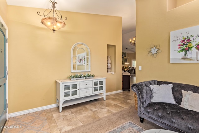 36641 N Railway St, San Tan Valley, AZ 85140 - interior space with baseboards and an inviting chandelier