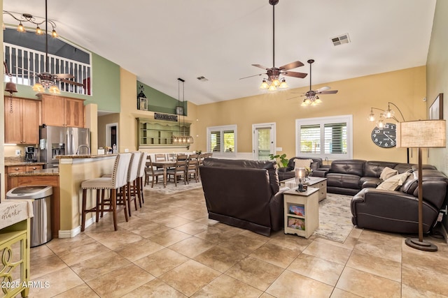 36641 N Railway St, San Tan Valley, AZ 85140 - living room featuring light tile patterned flooring, high vaulted ceiling, a ceiling fan, and visible vents