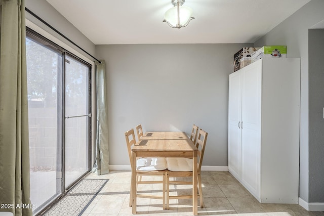 dining area with light tile patterned floors