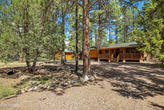 chalet / cabin featuring a porch