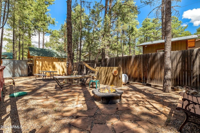 view of patio featuring a fire pit