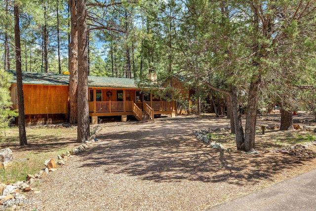 view of front of property featuring a wooden deck