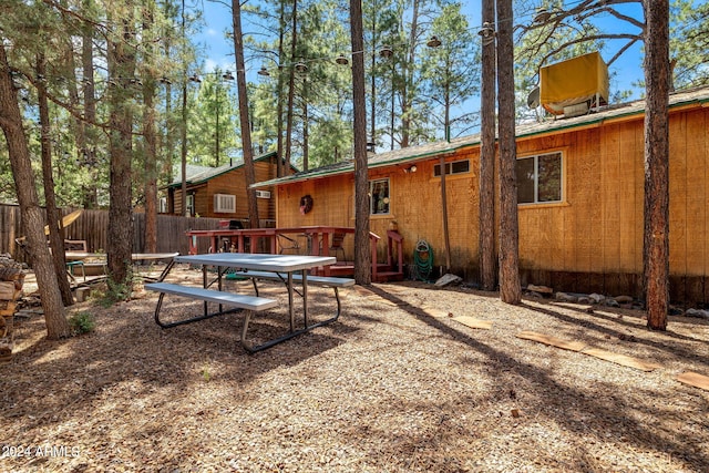 view of yard with fence and a deck