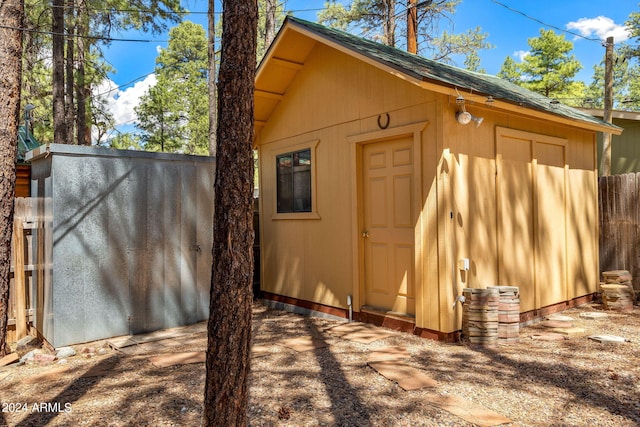 view of shed with fence