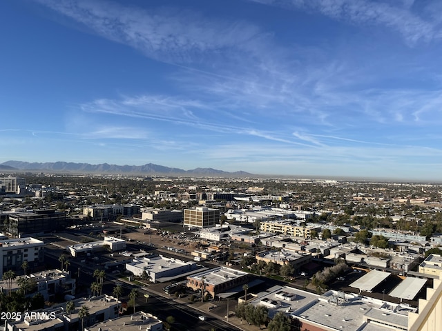 drone / aerial view with a mountain view and a city view