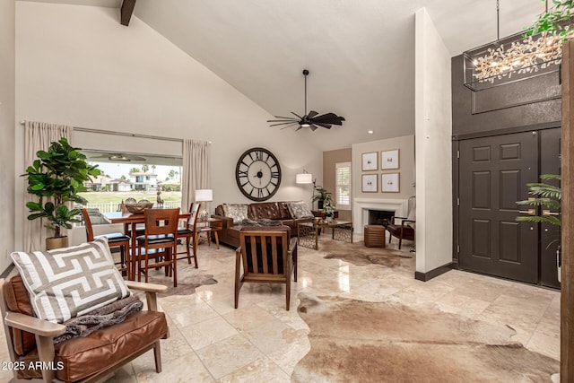 10826 E Navajo Dr, Sun Lakes, AZ 85248 - interior space featuring beamed ceiling, high vaulted ceiling, and ceiling fan with notable chandelier