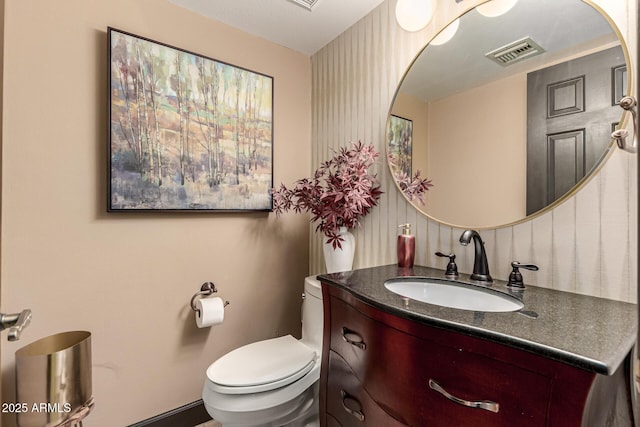 10826 E Navajo Dr, Sun Lakes, AZ 85248 - half bath featuring toilet, visible vents, vanity, and baseboards