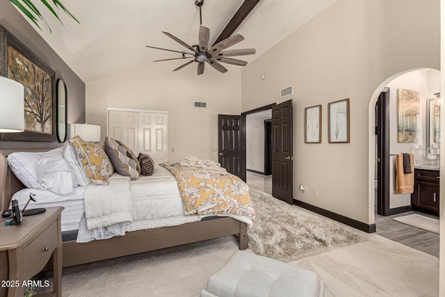 10826 E Navajo Dr, Sun Lakes, AZ 85248 - bedroom featuring visible vents, connected bathroom, a closet, and arched walkways