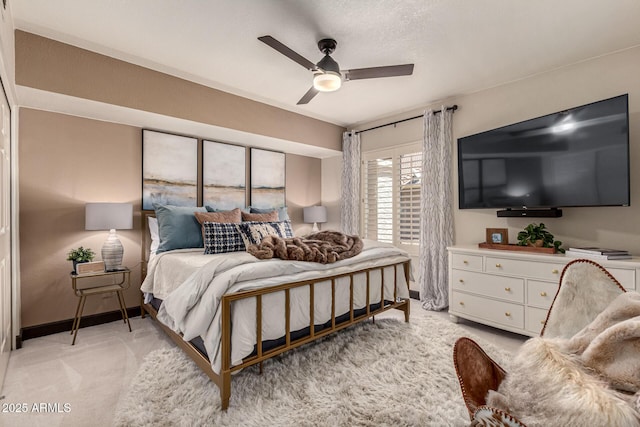 10826 E Navajo Dr, Sun Lakes, AZ 85248 - bedroom with baseboards, a ceiling fan, and light carpet