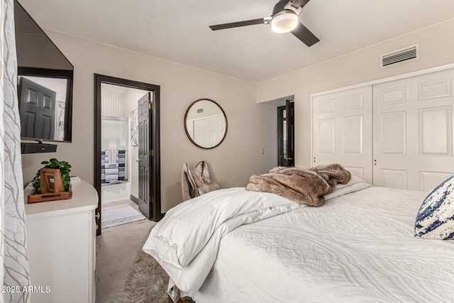 10826 E Navajo Dr, Sun Lakes, AZ 85248 - carpeted bedroom with visible vents, ensuite bathroom, a ceiling fan, and a closet