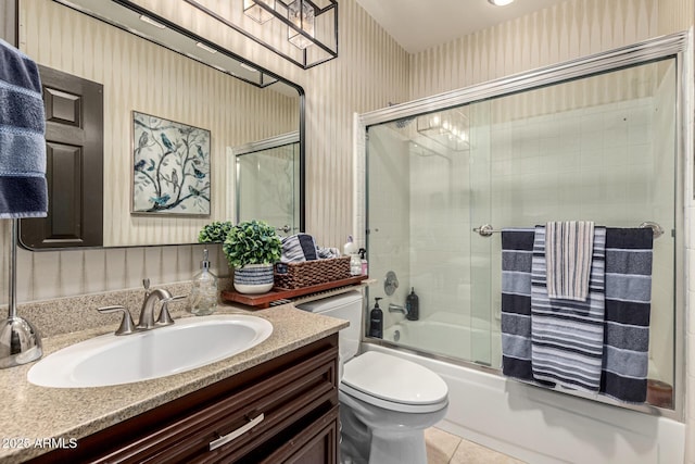 10826 E Navajo Dr, Sun Lakes, AZ 85248 - full bath featuring shower / bath combination with glass door, vanity, tile patterned floors, toilet, and wallpapered walls