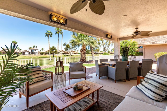 10826 E Navajo Dr, Sun Lakes, AZ 85248 - view of patio with outdoor dining space, ceiling fan, outdoor lounge area, and a fenced backyard