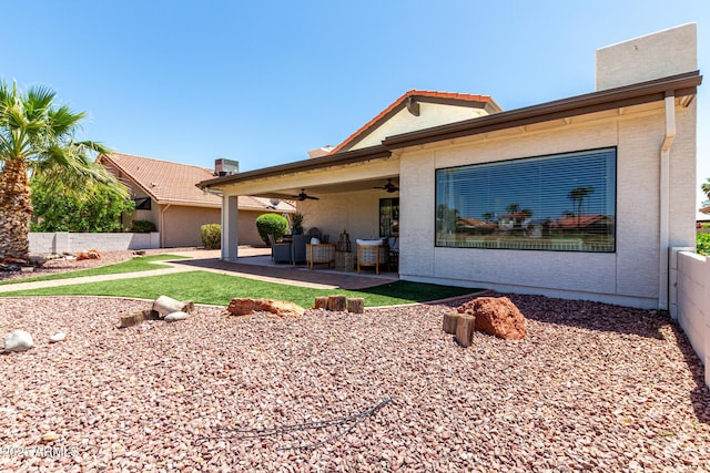 10826 E Navajo Dr, Sun Lakes, AZ 85248 - view of front of property with stucco siding, ceiling fan, a front lawn, and a patio area