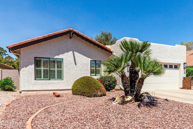 10826 E Navajo Dr, Sun Lakes, AZ 85248 - view of front of property featuring fence, stucco siding, concrete driveway, and an attached garage