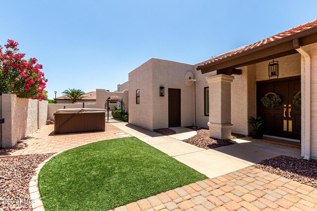 10826 E Navajo Dr, Sun Lakes, AZ 85248 - view of yard featuring a hot tub, fence private yard, and a patio area
