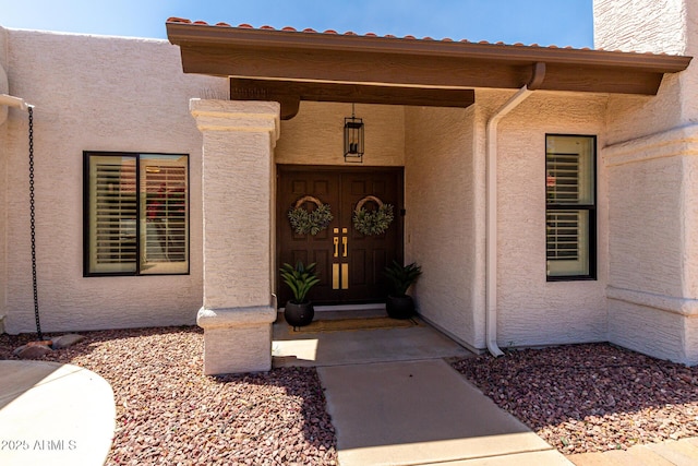 10826 E Navajo Dr, Sun Lakes, AZ 85248 - doorway to property featuring stucco siding